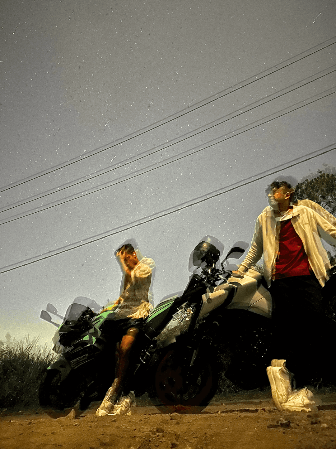 Parth and Jatin posing with their bikes